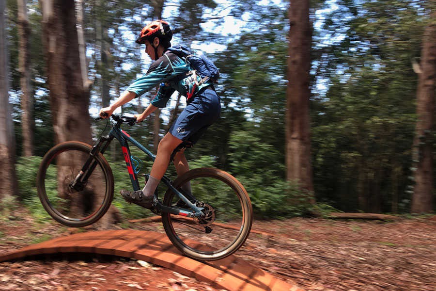 Getting a little air on a wood wave in Maui