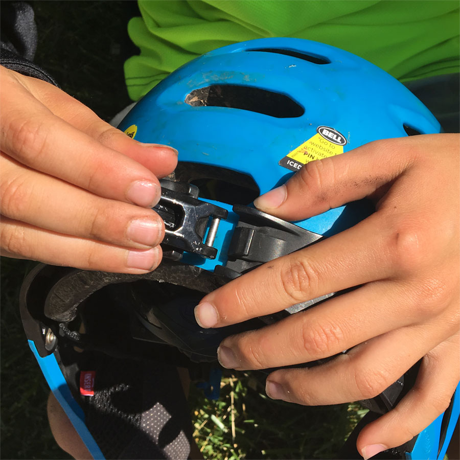 Bell Super 2r Helmet Review - rear clasp being done by 10-year old