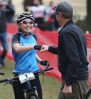 A rider gives a race organizer a fist bump at the 2016 Wisconsin NICA State Championships