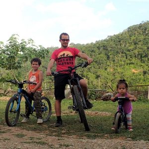 Mountain biking dad with his kids