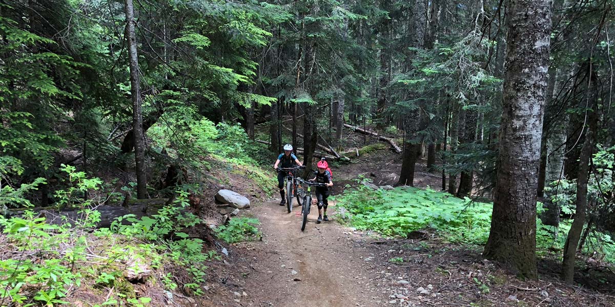 Mother and son doing some hike-a-bike on Into The Mystic