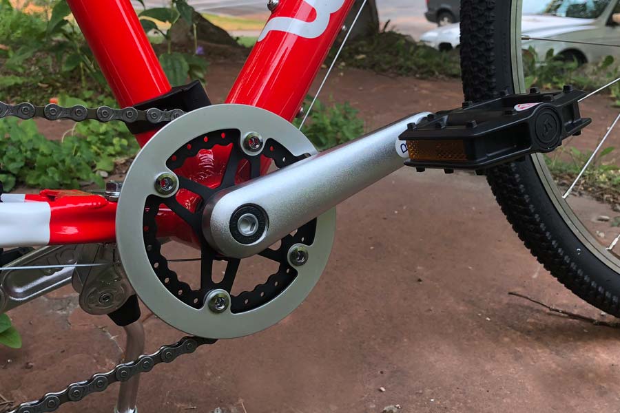Custom designed and formed crankset on the Woom 5 children's bike