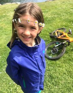 Happy kid with her mountain bike