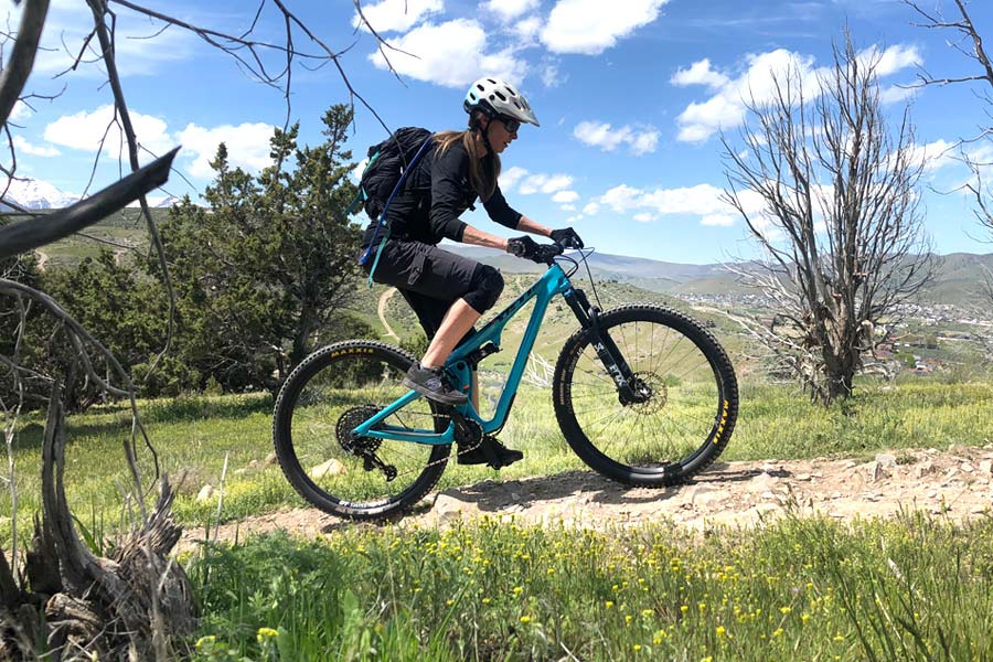 Traci mountain biking with the Yeti SB100