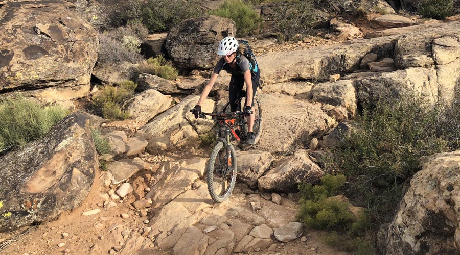 Mom does a technical section of the Barrel Roll trail