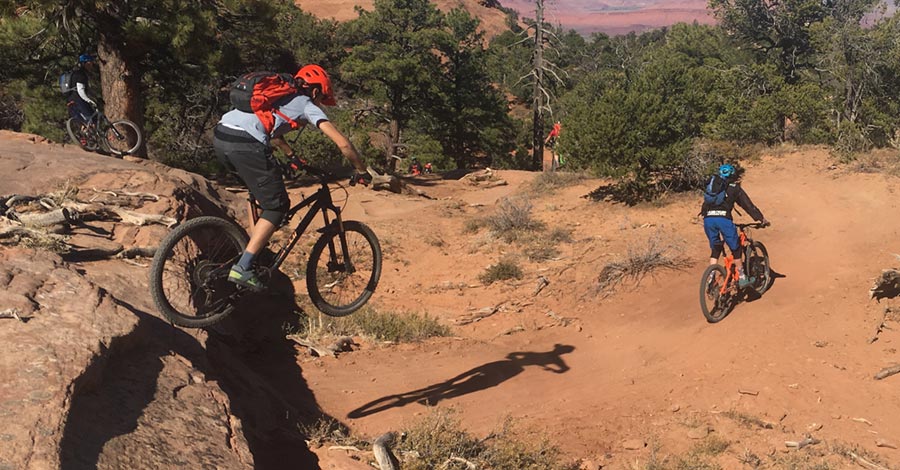 Sending a drop on The Whole Enchilada mtb trail - Moab, UT