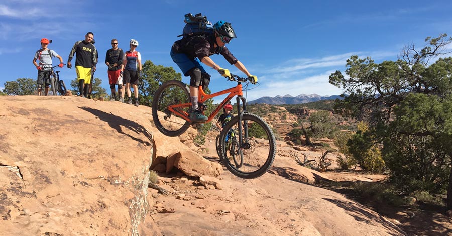 Wyatt sends a drop while riding The Whole Enchilada near Moab, Utah