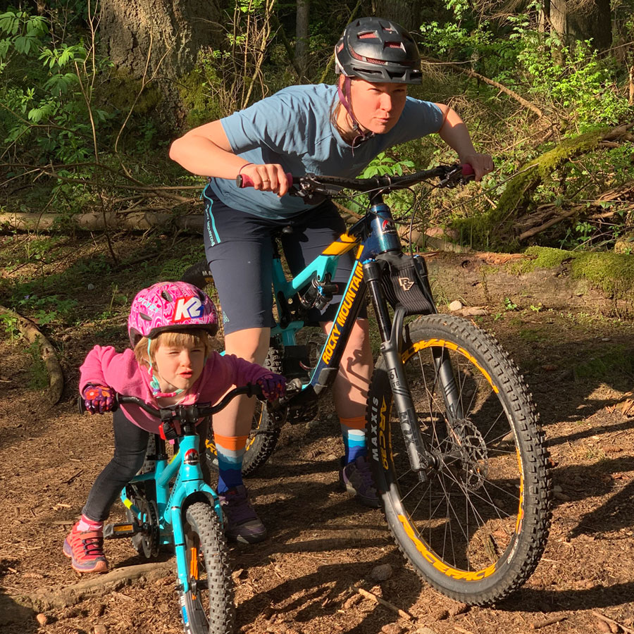 Mother and daughter on mountain bikes