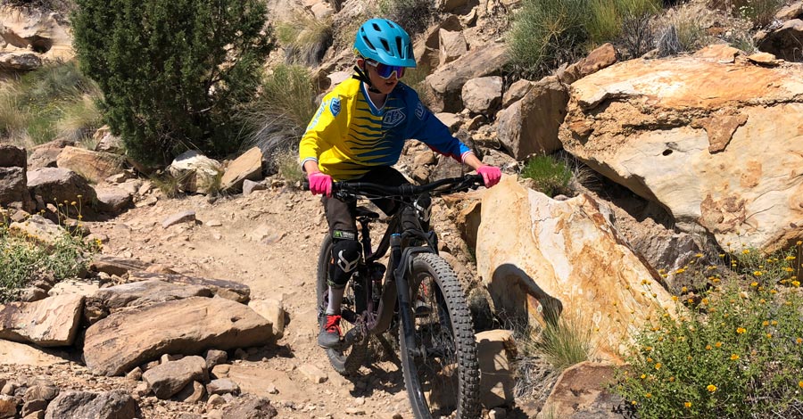 Kid riding mountain bike with the Bontrager Quantum helmet