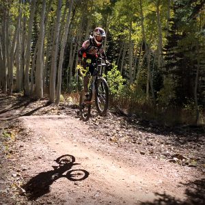 Grom sending a jump at Deer Valley Resort - Park City Mountain biking for families