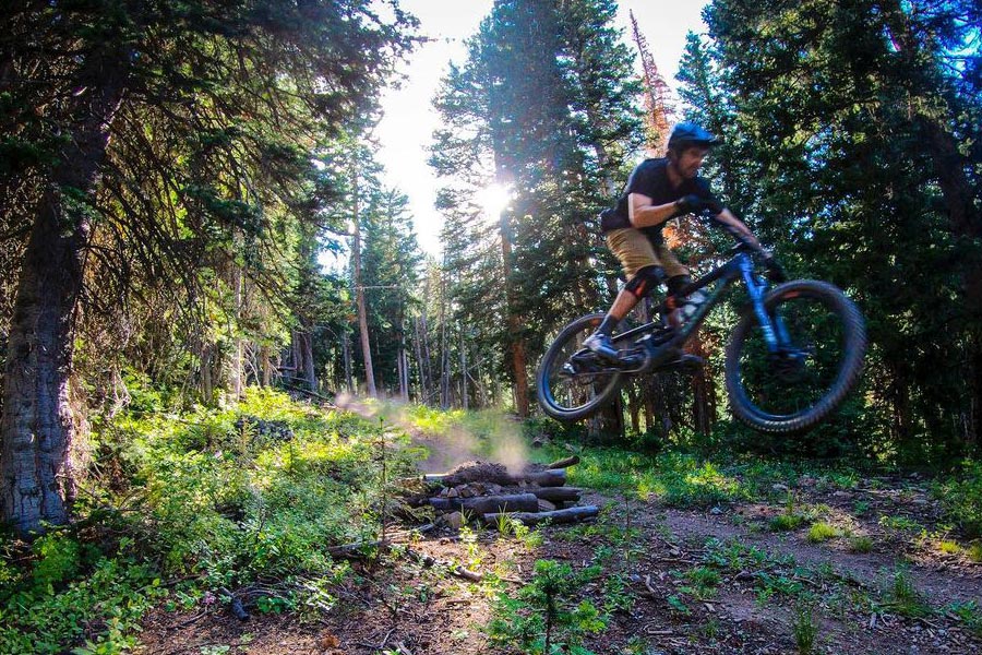 Tim McChesney trades in the skis for mountain biking during the summer in Park City, UT